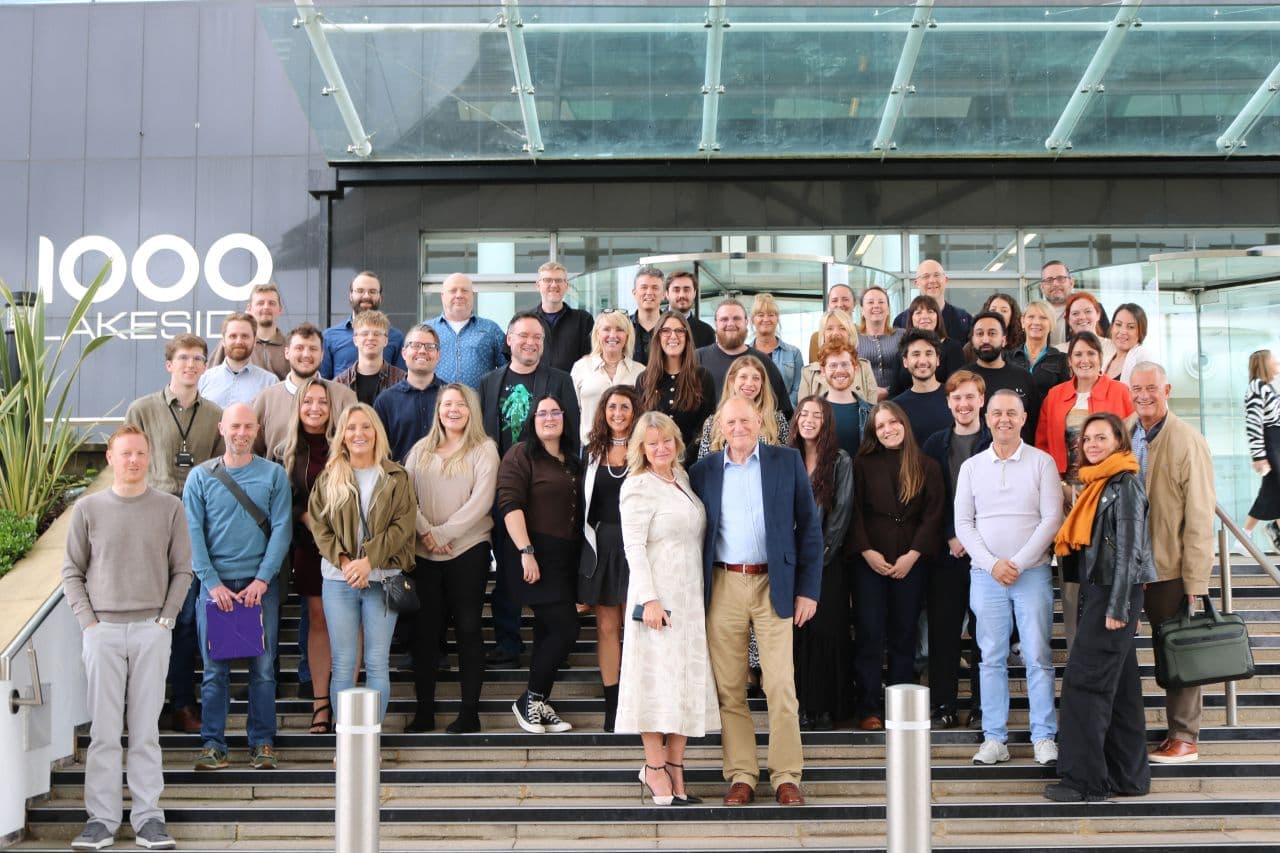 BookMyGarage employees celebrating 10 years of success with founders Karen & Douglas Rotberg
