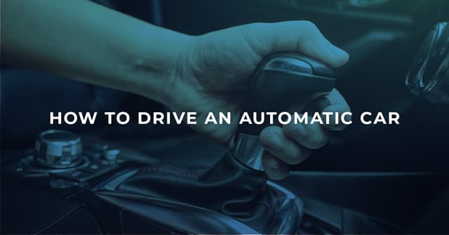 The article title over an automatic car gear stick, with the driver holding it in drive. 
