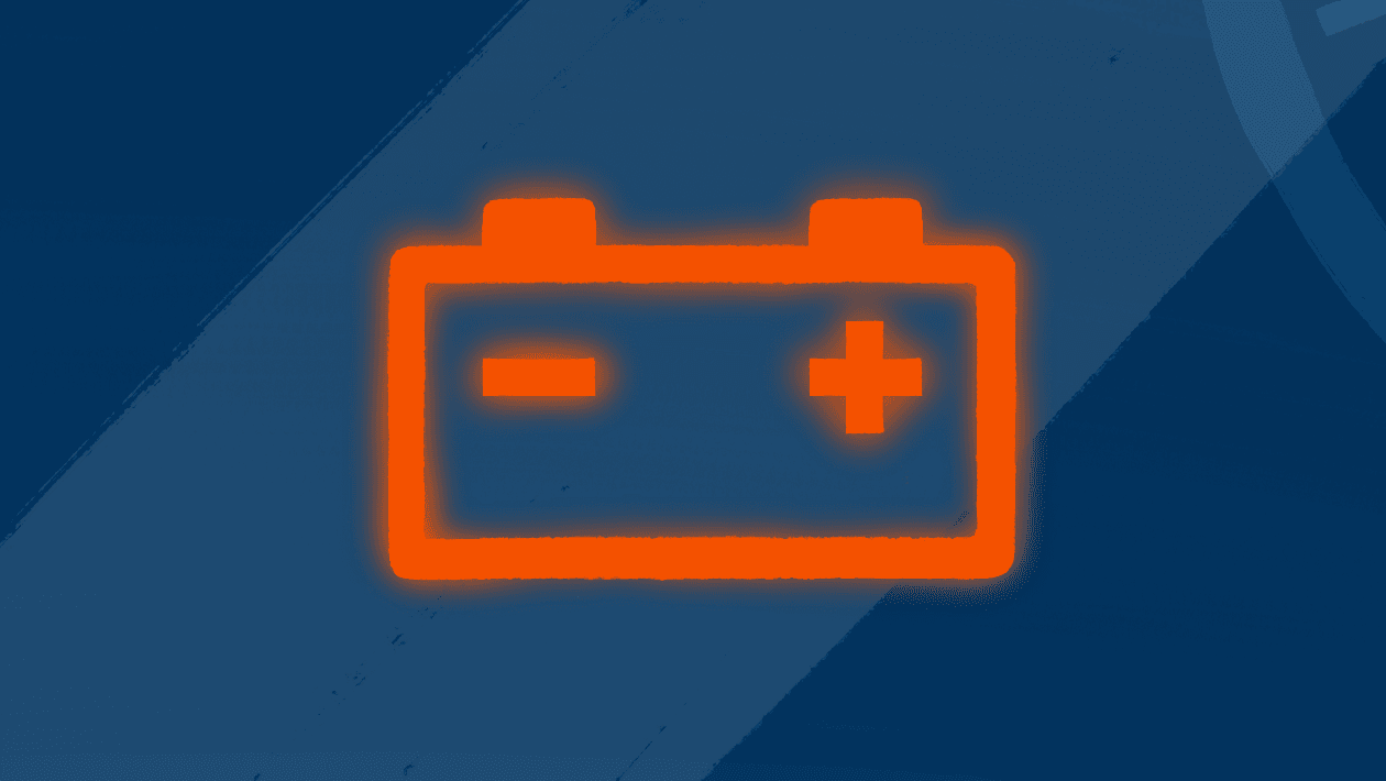 red car battery warning light on dark blue background