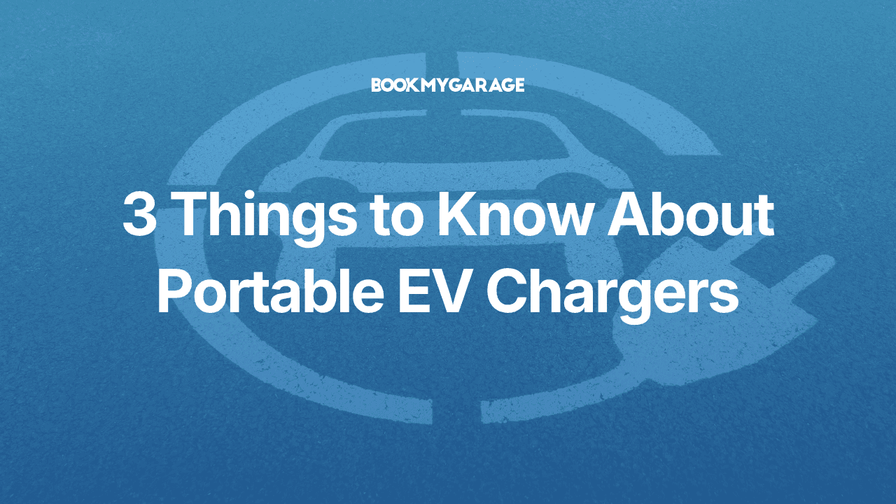 White symbol on asphalt road showing charging plug curling around stylised EV