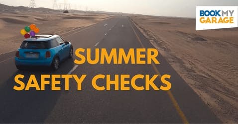 A blue Mini Cooper driving through a desert, with text reading 'Summer Safety Checks'