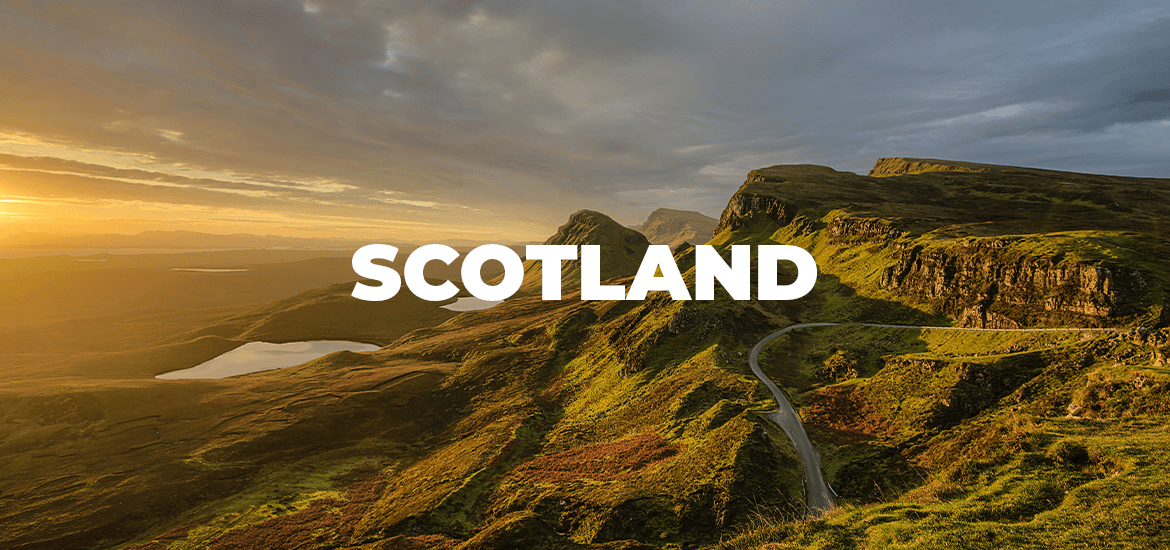 The article title over a beautiful view of a road winding through grassy hills in Scotland.