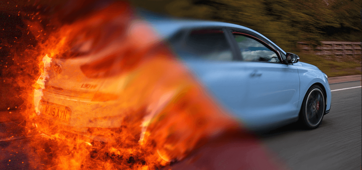 The article title over a car driving on a road, with an overlay of fire on the rear of the vehicle.