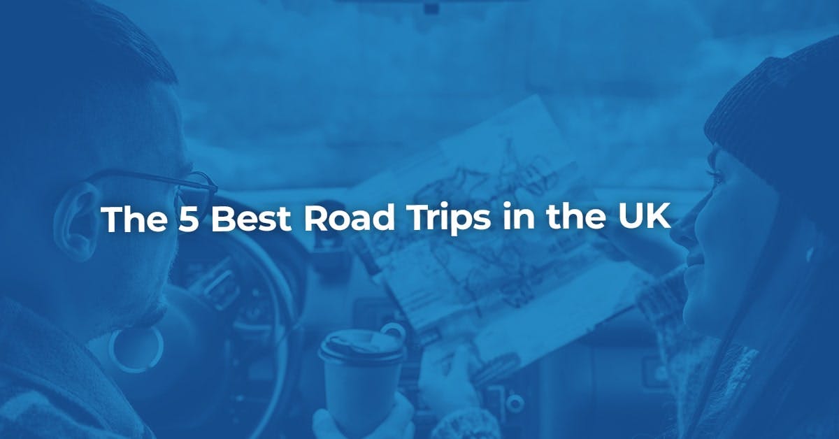 The article title over a man and woman sitting in their car, planning their UK road trip with a map.