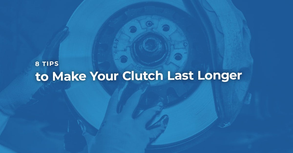 The article title over a mechanic holding a clutch during maintenance.