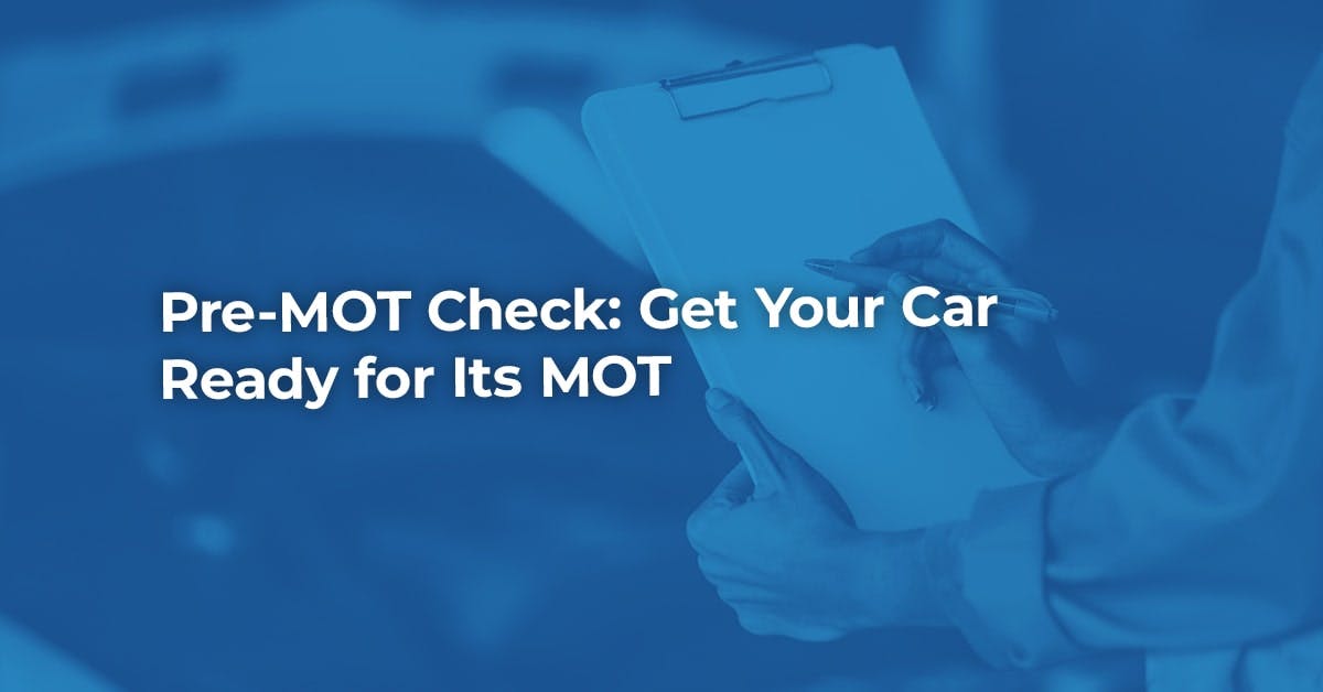 The article title over a mechanic taking pre-MOT check notes on a clipboard, in a blue overlay.