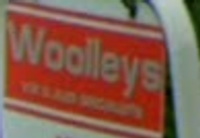WOOLLEYS SERVICE STATION Logo