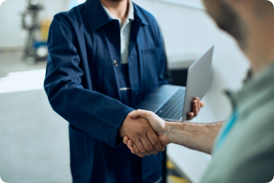 Men shaking handes with laptop